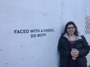 A picture of Dr. Melanie Sage next to the word "Faced with a choice, do both"